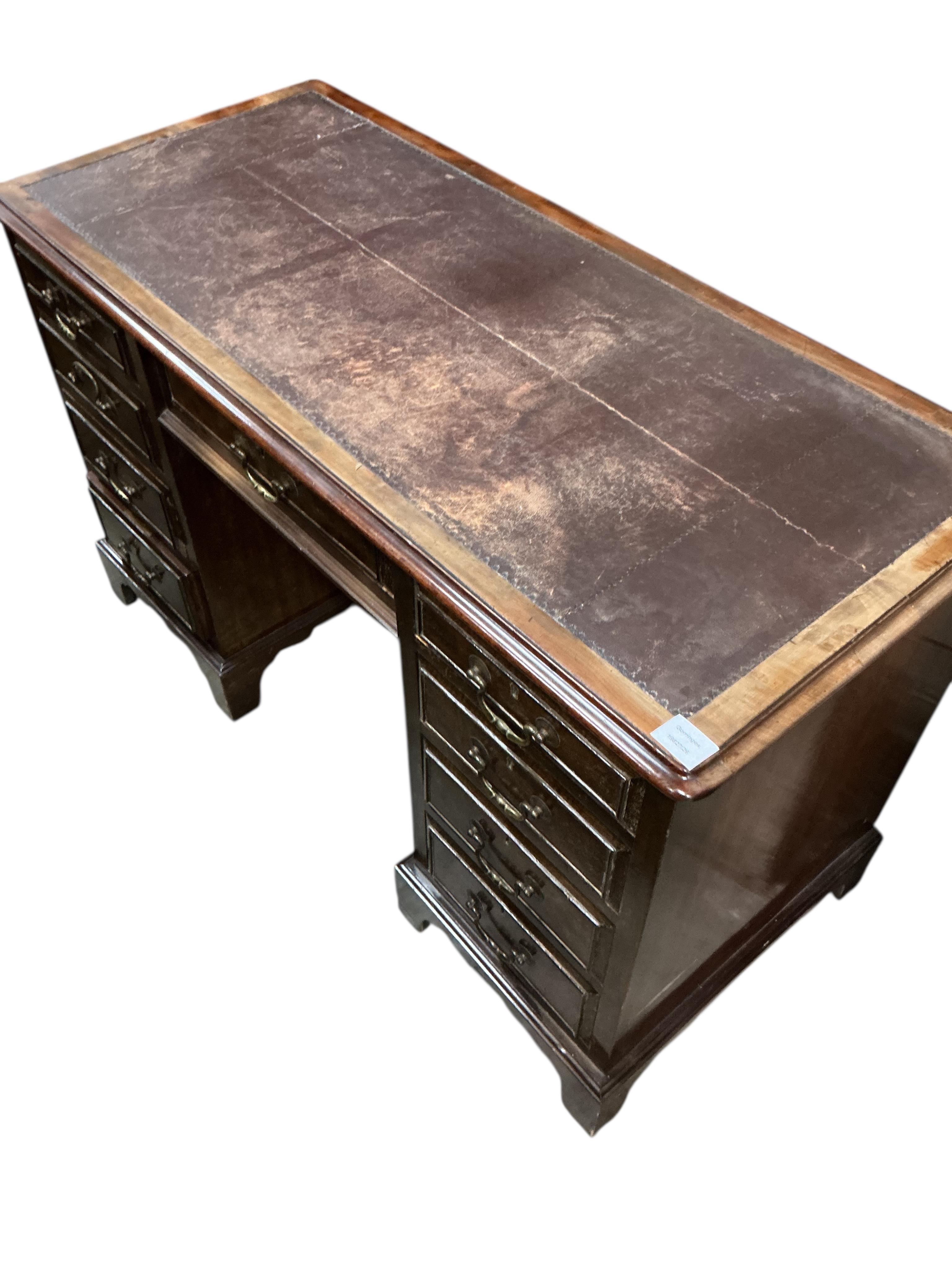 An early 20th century mahogany kneehole desk, width 121cm, depth 55cm, height 75cm